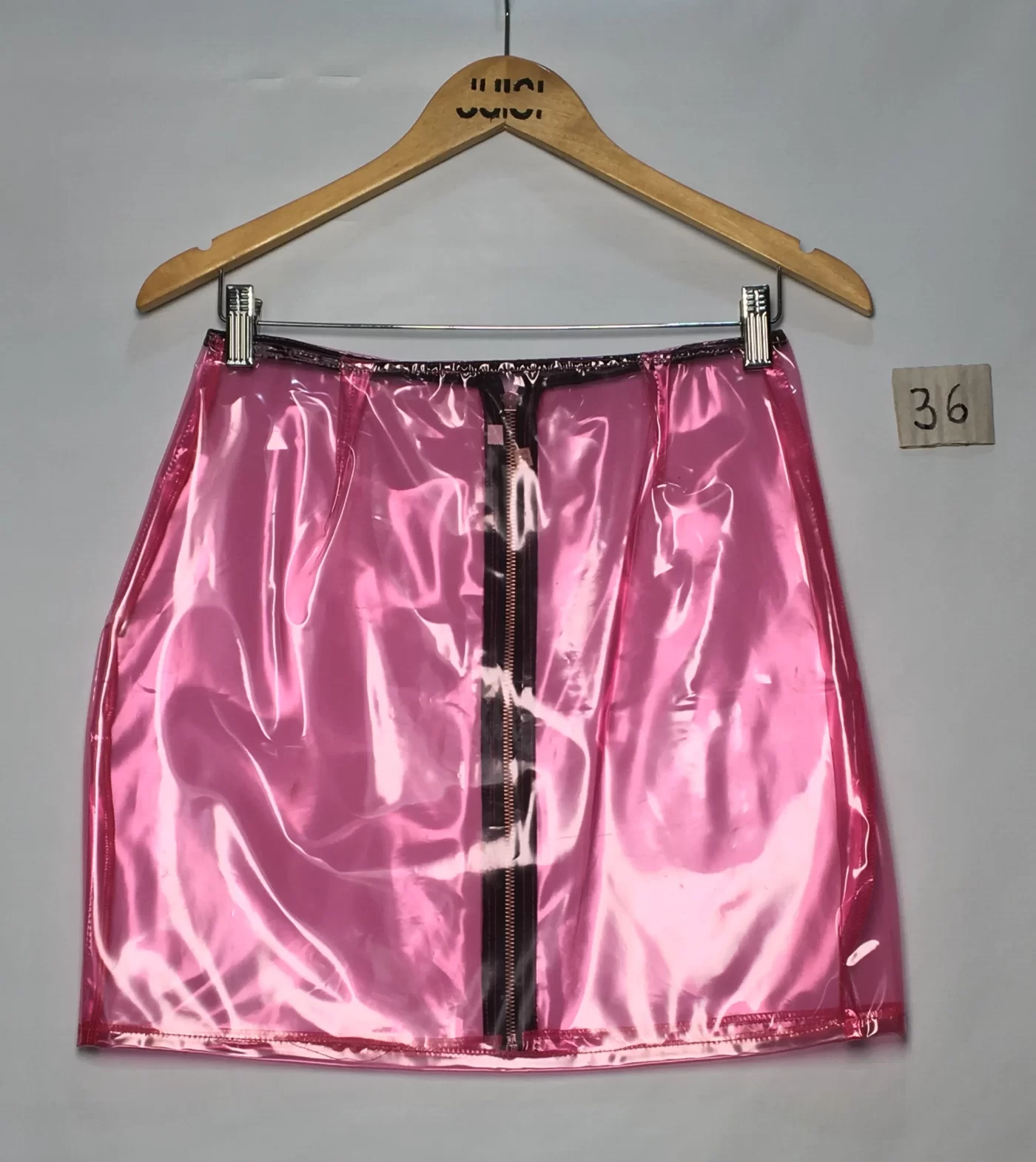 SAIA PLASTICO ROSA ZIPER CURTA