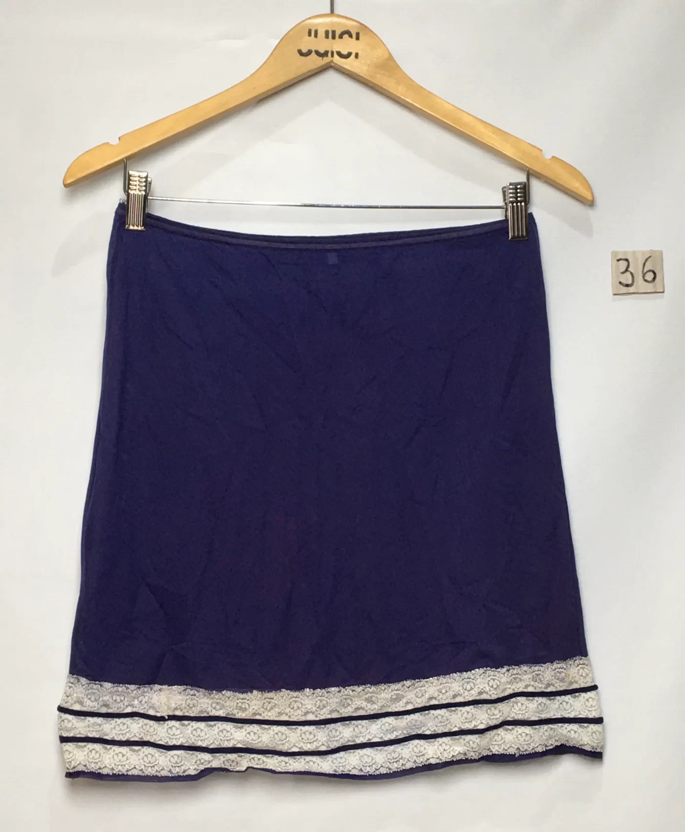 SAIA MINI AZUL MARINHO COM DETALHE DE RENDA NA BARRA