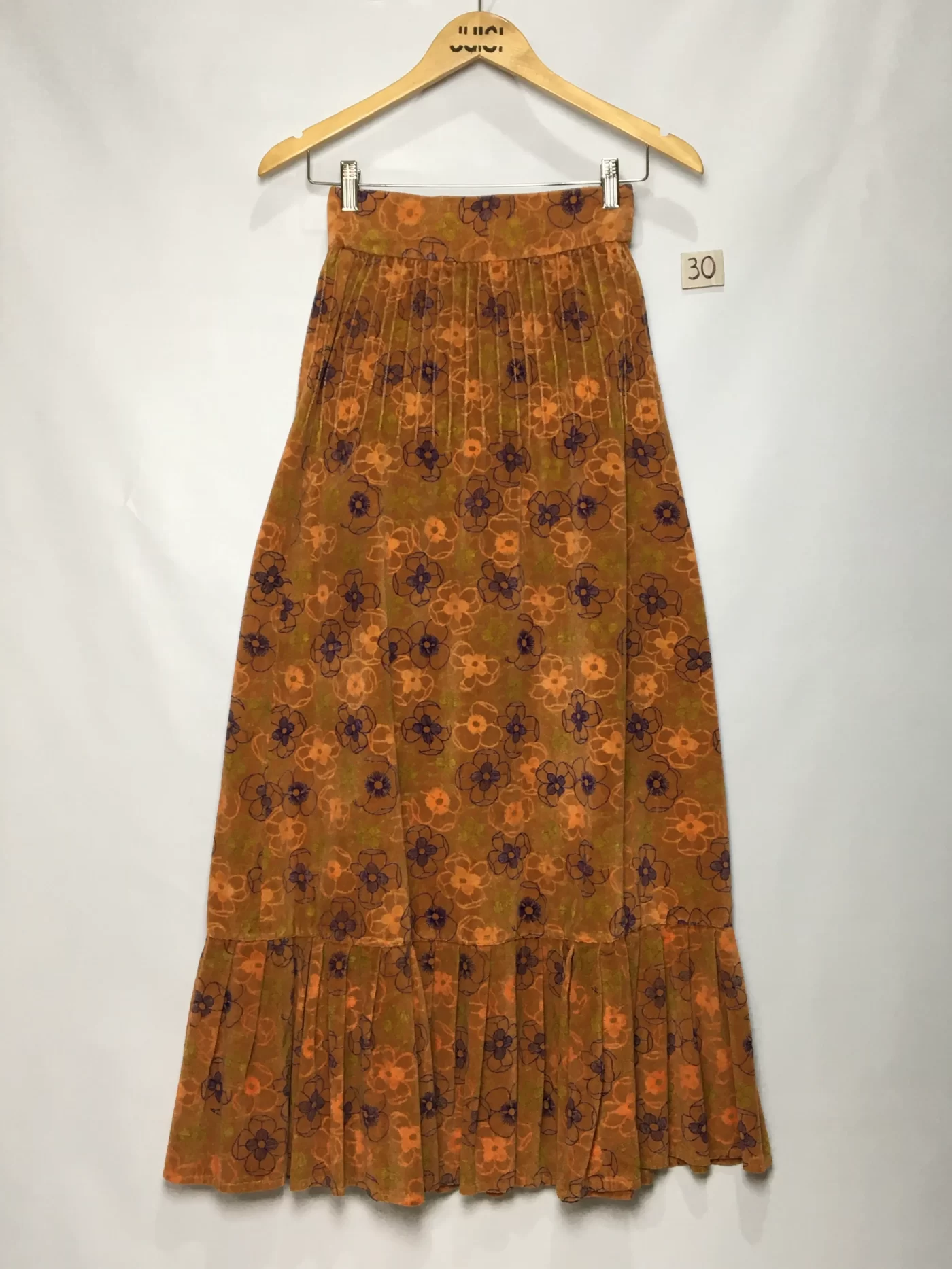 SAIA LONGA ESTAMPA FLORAL EM TONS DE LARANJA E ROXO BABADO NA BARRA